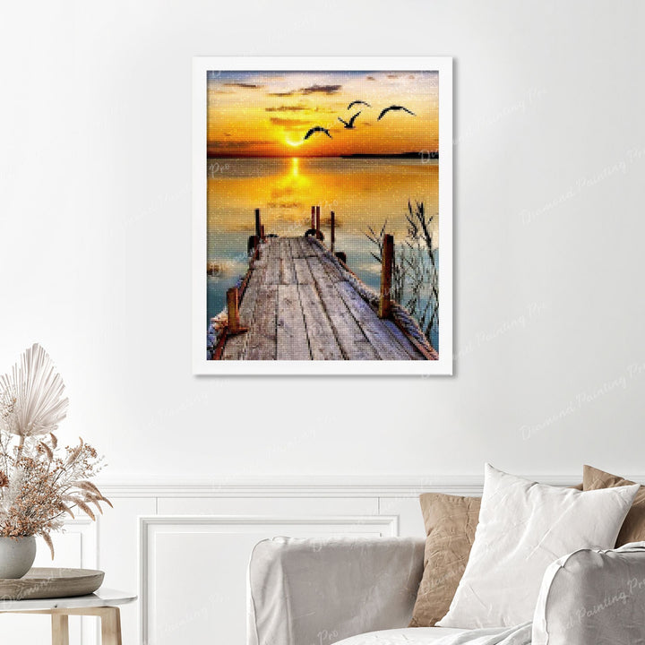 Lakeside Sunset Jetty Bliss Finished Diamond Painting Displayed with White Frame as Home Decor