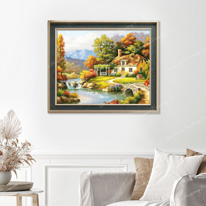 Autumn Cottage by the River Finished Diamond Painting Displayed with Vintage Frame as Home Decor